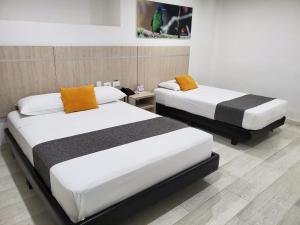 Postel nebo postele na pokoji v ubytování Hotel Cafeira