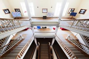 an overhead view of a staircase in a building at Maloja Palace Residence Engadin-St Moritz CO2-Neutral in Maloja