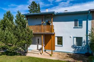 a house with a large deck on the side of it at Lakeview beach apartment in Viljandi in Viljandi