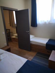 Postel nebo postele na pokoji v ubytování Apartments&Camping ZIP