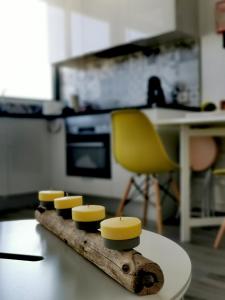 a block of cheese on a piece of wood on a table at Tarik Moments Apartment in Portimão