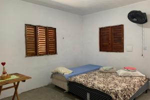 Een bed of bedden in een kamer bij Recanto Maristela