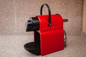 a red suitcase sitting on top of a counter at Apartaments Ashome in Canillo