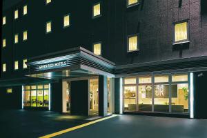 a store front of a building with a sign on it at Green Rich Hotel Yamaguchi Yuda Onsen in Yamaguchi