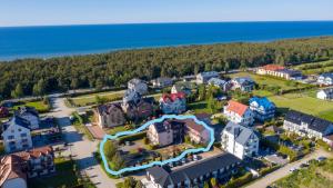 an aerial view of a resort with a large building at Best in Karwia