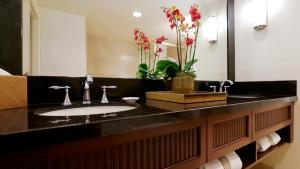 a bathroom with two sinks and a mirror at Santa Barbara Inn in Santa Barbara