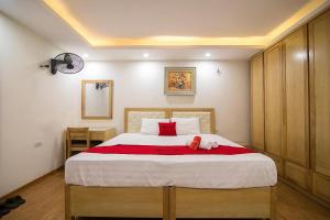Postel nebo postele na pokoji v ubytování Galaxy Hanoi Hotel & Apartment - 12 ngõ 80 Trần Duy Hưng