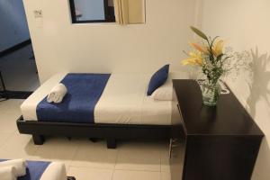 Postel nebo postele na pokoji v ubytování Hotel Cafeira