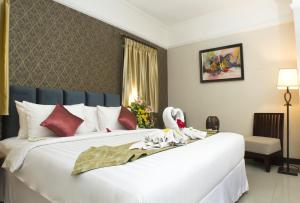 Postel nebo postele na pokoji v ubytování Amarelo Hotel Solo