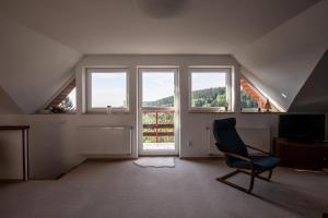 Posedenie v ubytovaní Apartmány nad Šlikovkou