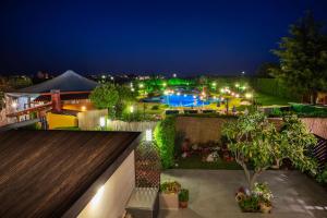 a view of a backyard at night with a pool at B&B LATORRACA in Palazzo San Gervasio