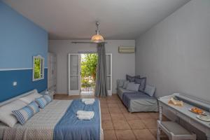 Postel nebo postele na pokoji v ubytování Pelagos Apartments + 37 fotografií
