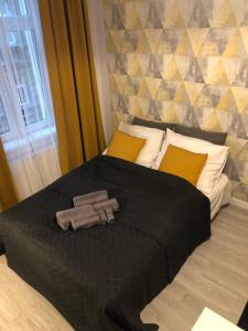 Posteľ alebo postele v izbe v ubytovaní Apartamenty Centrum