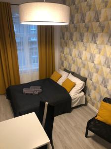 Posteľ alebo postele v izbe v ubytovaní Apartamenty Centrum