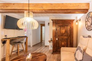 Μια τηλεόραση ή/και κέντρο ψυχαγωγίας στο Domaine La Grange Ungersheim - Gîte La Grange 5 étoiles
