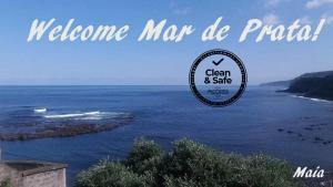 a picture of the ocean with a sign that reads welcome map dc pratta at Mar de Prata in Maia