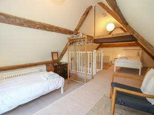 Ліжко або ліжка в номері Kings Cottage - South