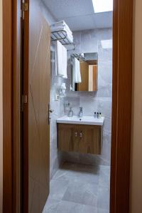 a bathroom with a sink and a mirror at West Palace in Istanbul +48 photos