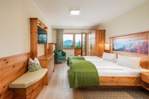 Postel nebo postele na pokoji v ubytování Aparthotel Ramsau