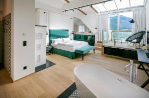 a bedroom with a bed and a living room at Landhaus zu Appesbach in St. Wolfgang