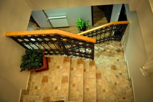 a staircase leading up to a room with a staircase at Hotel Evropa in Podgorica