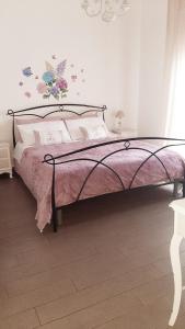 Posteľ alebo postele v izbe v ubytovaní B&B La Perla Bianca