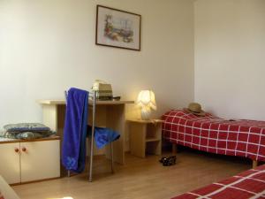 a bedroom with a desk and a bed and a desk at Dasen in Umag