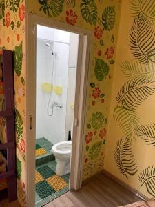 a bathroom with a shower and a toilet in it at Хостел Жить просто 2 in Pyatigorsk