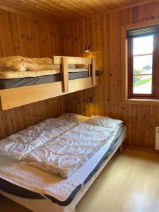 Säng eller sängar i ett rum på Hafjell Grenda lejligheder