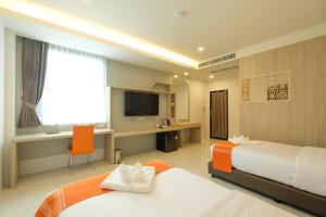 Monte Maesot hotel客房内的一张或多张床位