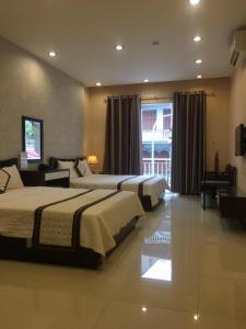 Ένα ή περισσότερα κρεβάτια σε δωμάτιο στο Thai Hoa Hotel +35 φωτογραφίες