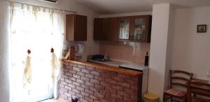 Kuchyň nebo kuchyňský kout v ubytování Apartment Monica