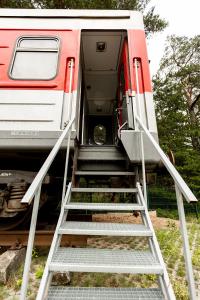 an open door of a train with stairs on it at Palanga Camping Hostel in Palanga
