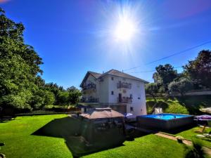 a house with a swimming pool in a yard at Vila Katarina in Vrnjačka Banja