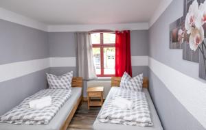 Ένα ή περισσότερα κρεβάτια σε δωμάτιο στο Lindenring Pension