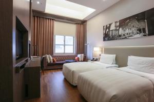 Katil atau katil-katil dalam bilik di City Suites - Taipei Nandong