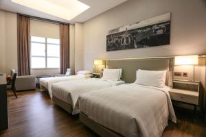 Katil atau katil-katil dalam bilik di City Suites - Taipei Nandong