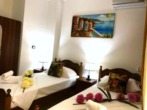 Postel nebo postele na pokoji v ubytování Hotel Mali i Robit