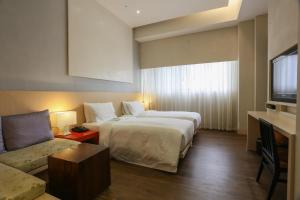 Katil atau katil-katil dalam bilik di City Suites - Taipei Nandong