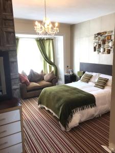 A bed or beds in a room at Wighthill Hotel 