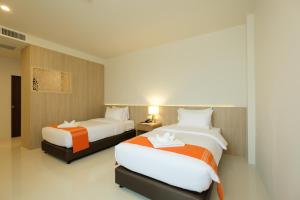 Monte Maesot hotel客房内的一张或多张床位