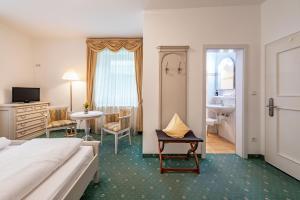 Postel nebo postele na pokoji v ubytování Hotel Weisse Lilie - B&B