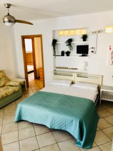 En eller flere senge i et værelse på Appartamenti Venere