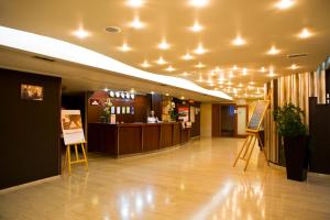 a lobby of a building with a reception desk and a lobby at Hotel Praha in Uzhhorod