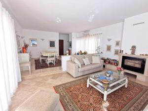 a living room with a couch and a table at Luxury 3 bedroom Villa with Private Pool in Cabanas de Tavira