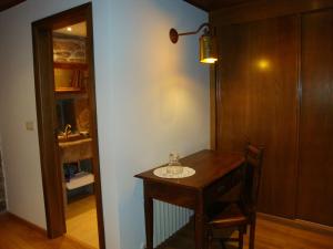 a room with a wooden table with a sink in it at Casa Da Laborada in Vilar de Perdizes