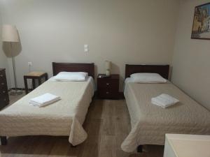 Ένα ή περισσότερα κρεβάτια σε δωμάτιο στο Hotel Διεθνές
