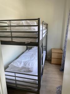 a couple of bunk beds in a room at Åndalsnes Sentrum Apartment No1 in Åndalsnes