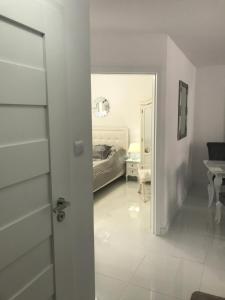 Posteľ alebo postele v izbe v ubytovaní Apartament Chanel Centrum