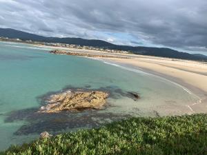 an aerial view of a beach and the ocean at Forever FOZ in Foz